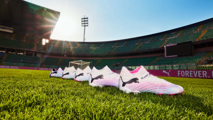 Side view of PUMA soccer cleats.